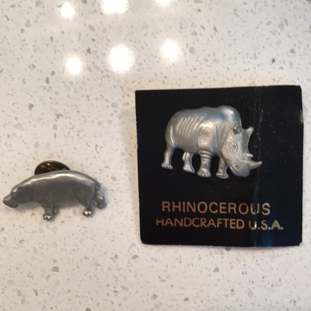 Vintage pins. Hippopotamus and a rhinoceros. May be pewter or silver tone.
